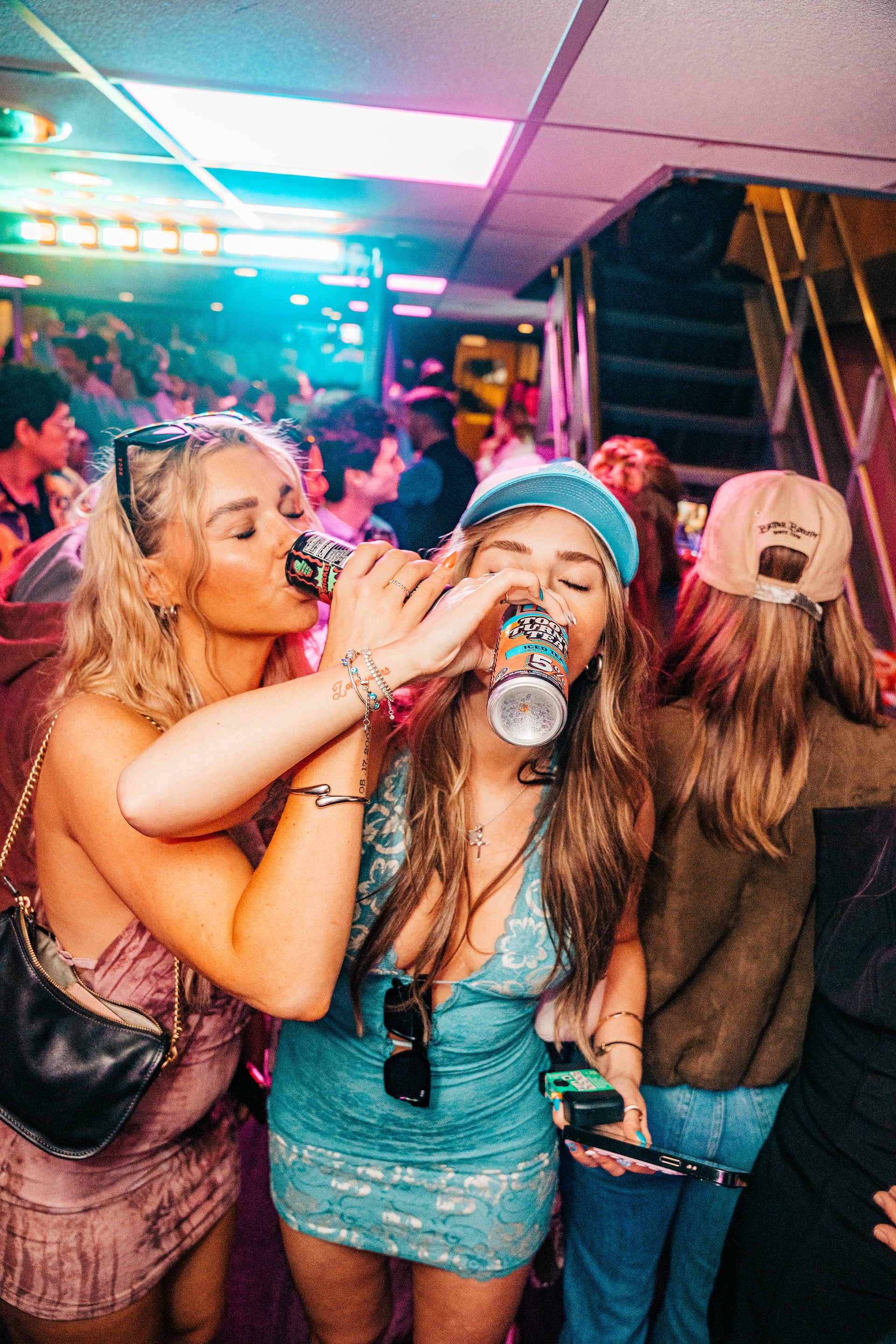 People with arms interlocked while drinking NOCA