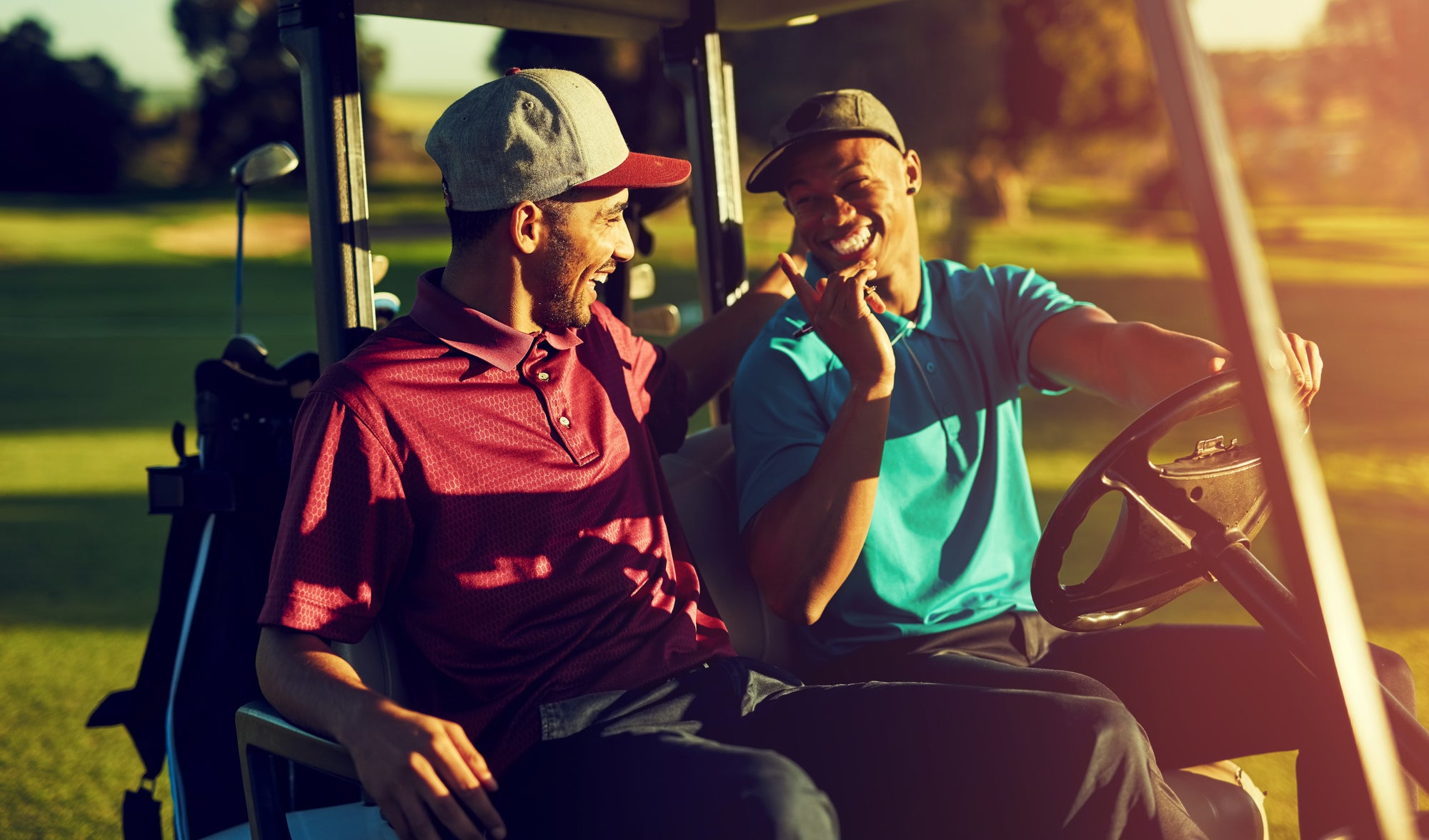 Two men in golf carts on a golf course